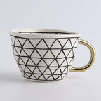 SacredHut | Cup with abstract geometric pattern and gold handle