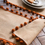 Jute Table Runner with Orange Pom-Poms, Boho Dining Table Decor — product view 4