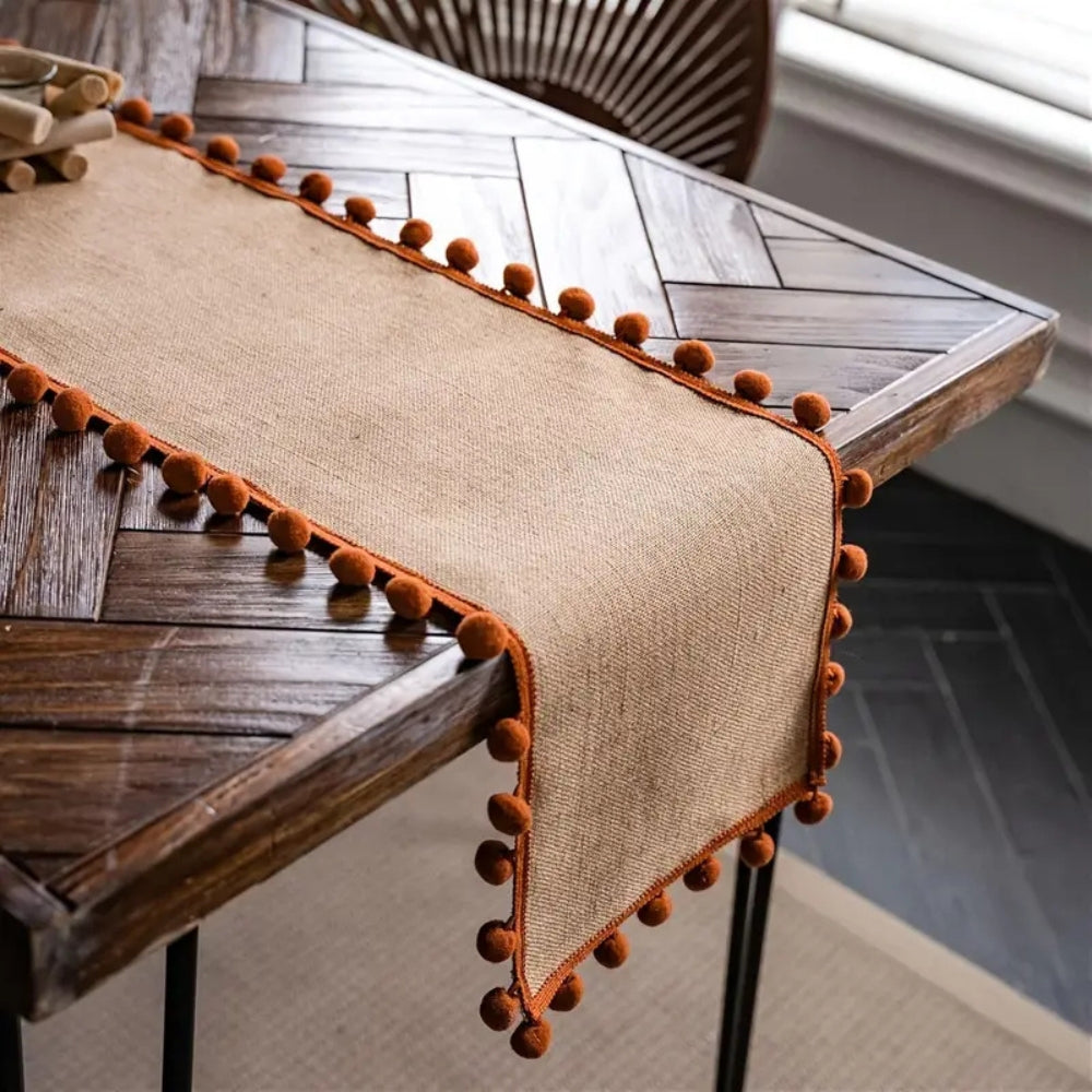 Jute Table Runner with Orange Pom-Poms, Boho Dining Table Decor — product view 2