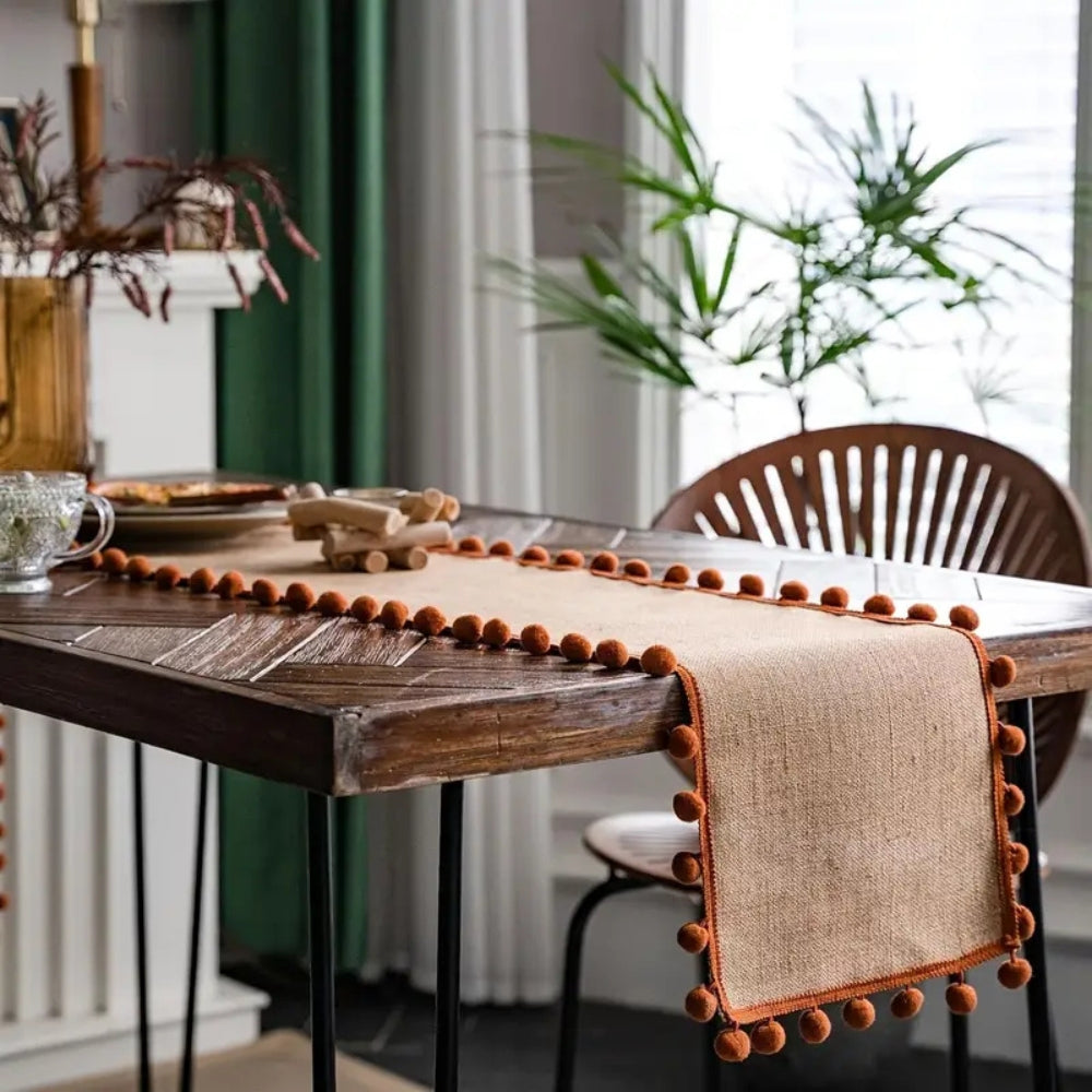 Jute Table Runner with Orange Pom-Poms, Boho Dining Table Decor — product view 3