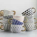 SacredHut | Cup with abstract geometric pattern and gold handle